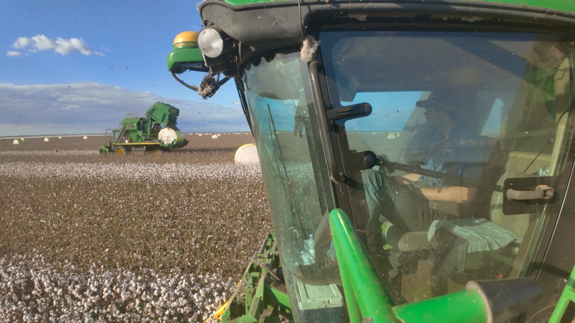 Cotton picker in-cab POV through the windscreen